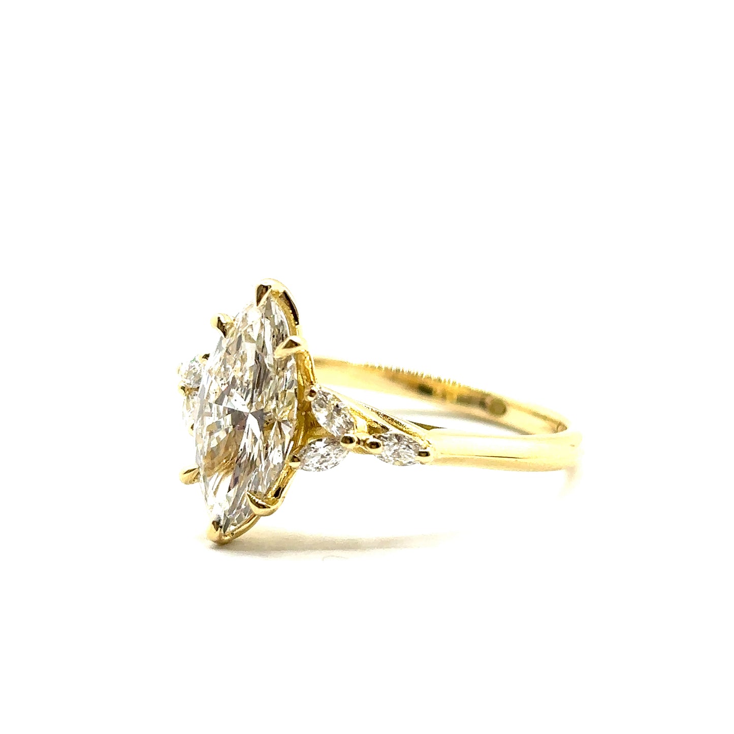 Bespoke Marquise Cut Diamond Engagement Ring 18ct Yellow Gold with 6 marquise side stones and a peridot set in the shank