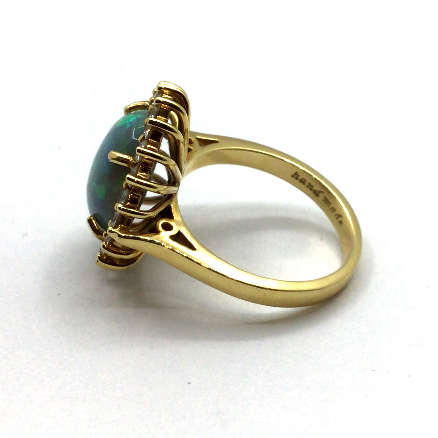 Opal and diamond halo 18ct yellow gold ring