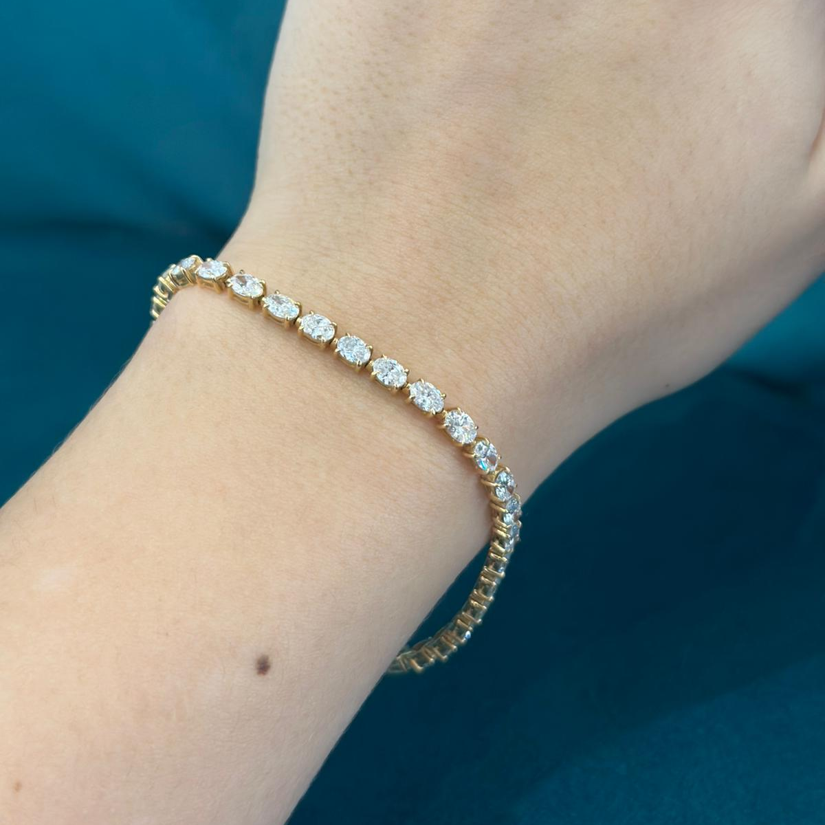 Oval Cut Diamond Tennis Bracelet Claw Set In 18ct Yellow Gold