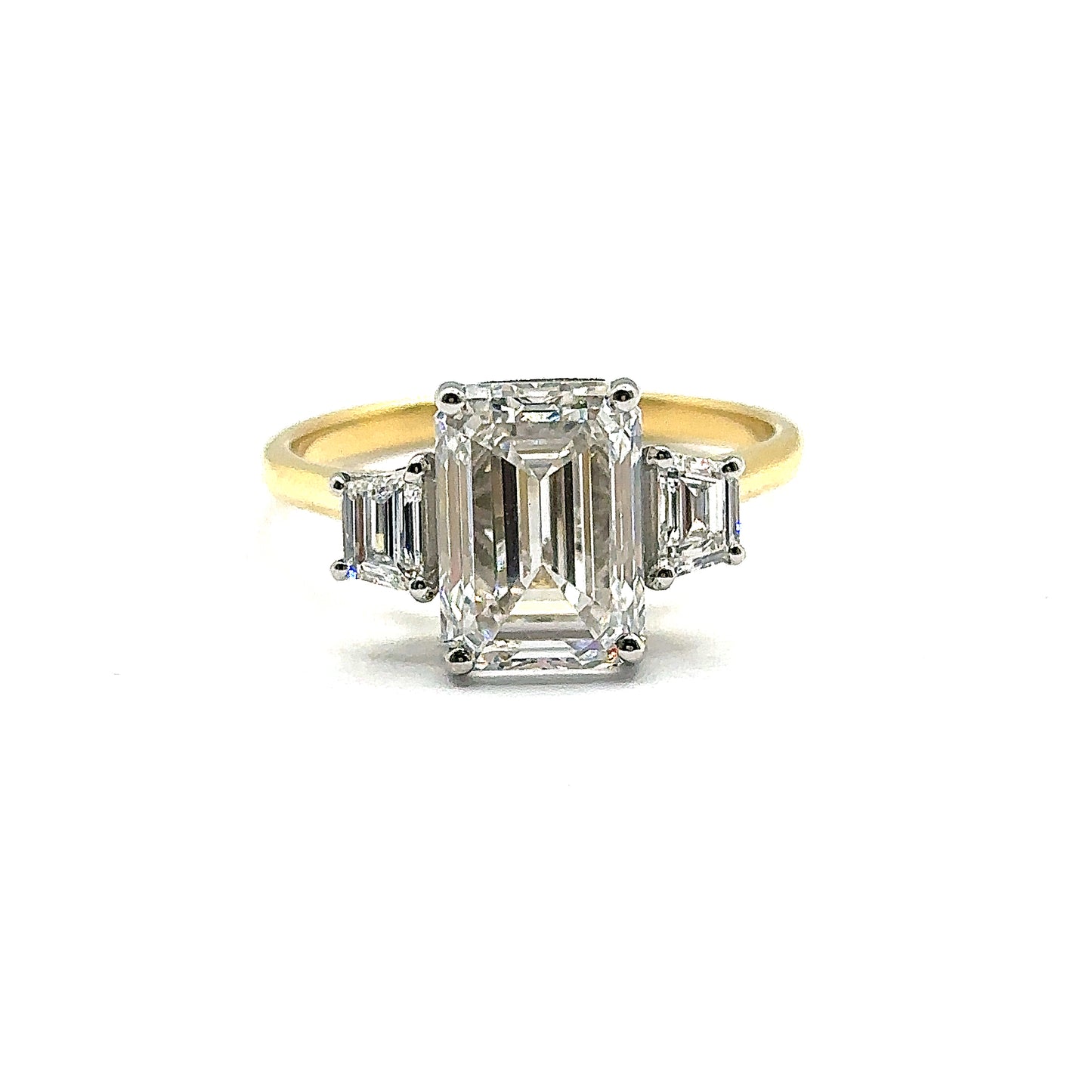 3ct Emerald Cut Diamond and Trapezoid Diamond Trilogy Ring in 18ct Yellow Gold with White Gold Head
