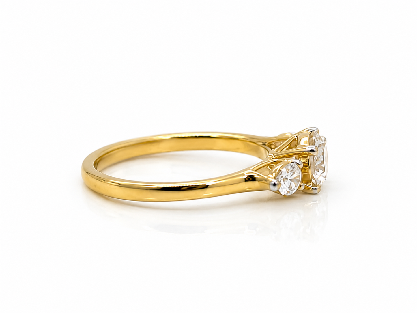 Diamond Trilogy Ring in Yellow Gold with a Round Brilliant Cut Centre