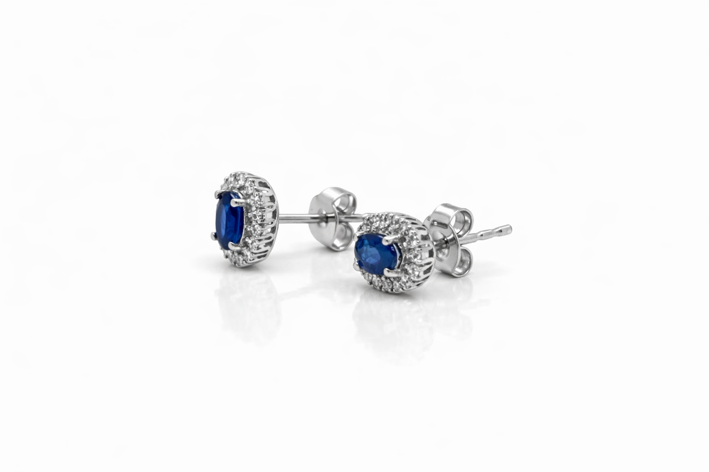 Oval Cut Sapphire and Diamond Halo Stud Earrings in 18ct White Gold
