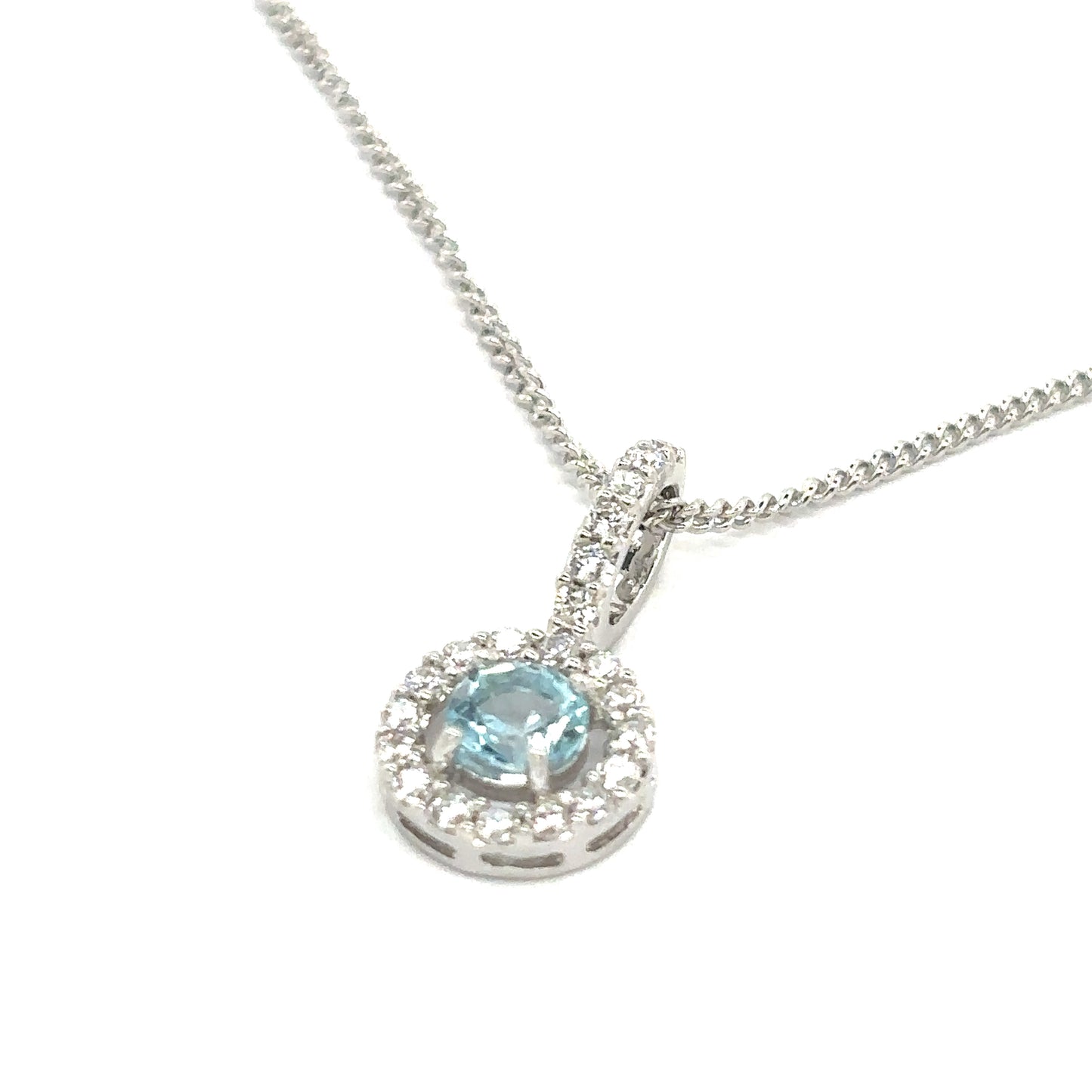 Round Brilliant Cut Sky Blue Topaz with a Cubic Zirconia Halo Set in Sterling Silver Pendant Necklace.