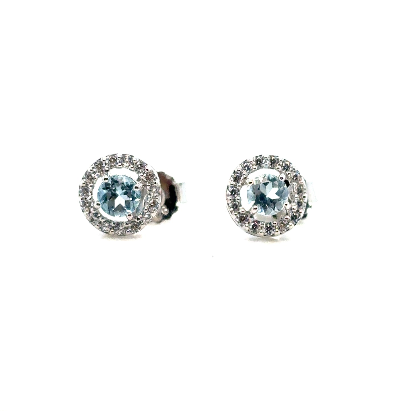 Round Sky Blue Topaz Halo Stud Earrings Set In Sterling Silver With Cubic Zirconia