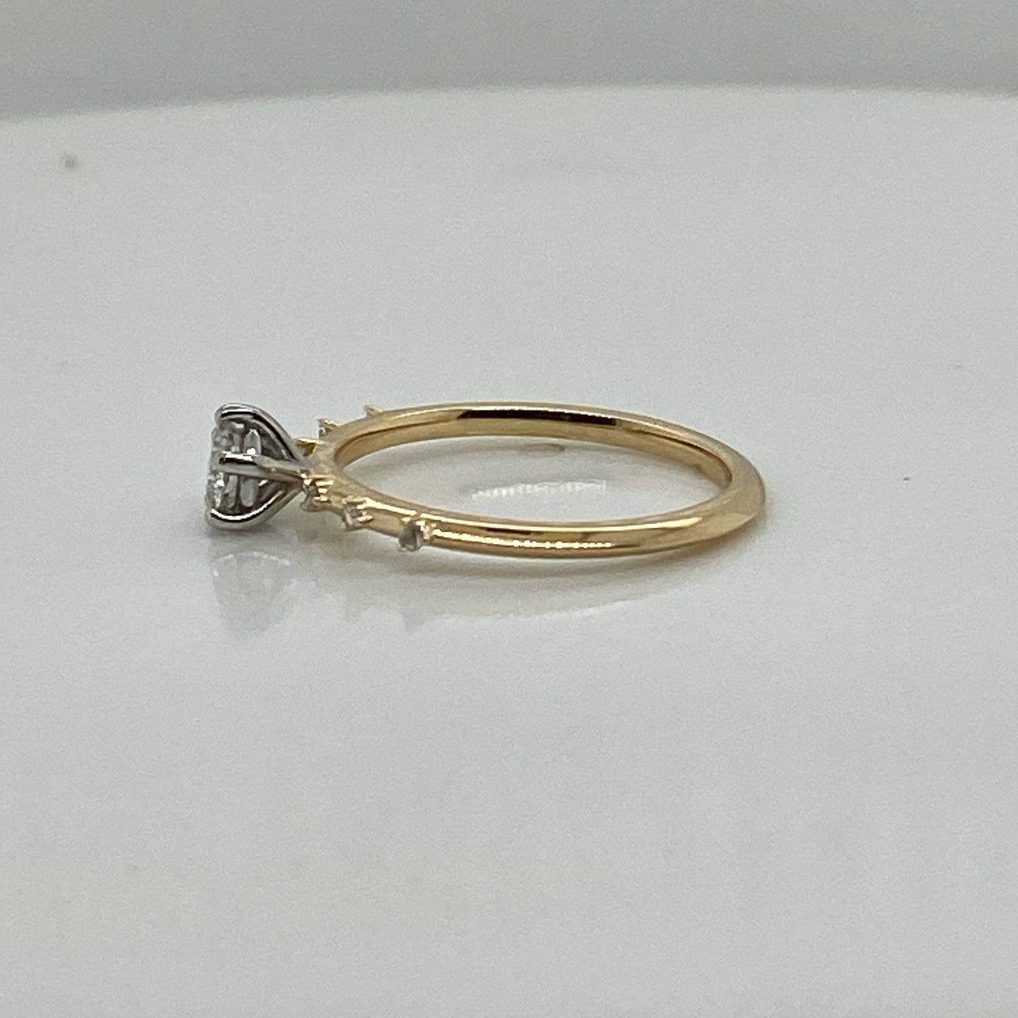 001683 BESPOKE: (using customers stones) 18ct yellow gold shank, stones along the band yellow claws. centre stone 5 cat claws in platinum ring finger size i.5