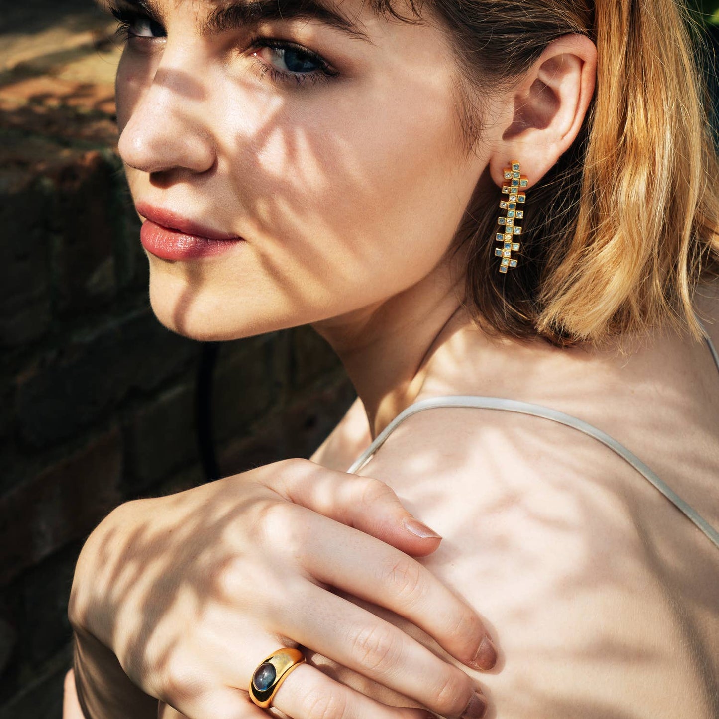 Gold and Sky Blue Topaz modern band ring