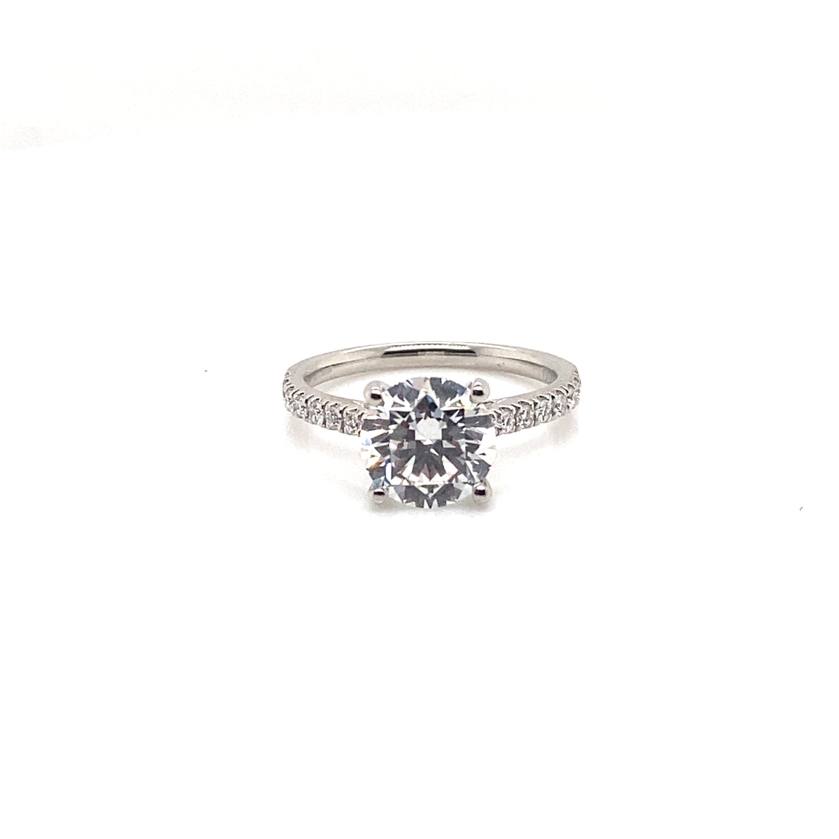 002046: platinum solitaire round cut diamond with pave set shoulders, tightened centre stone