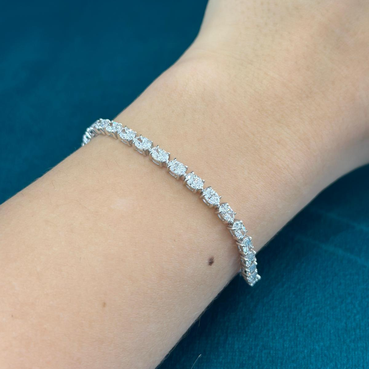 Oval Cut Diamond Tennis Bracelet Claw Set in 18ct White Gold