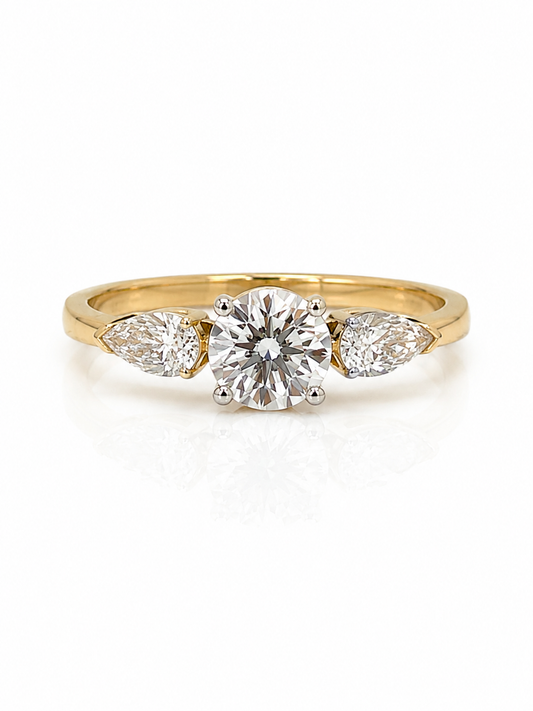Diamond Trilogy Ring in Yellow Gold with a Round Brilliant Cut Centre