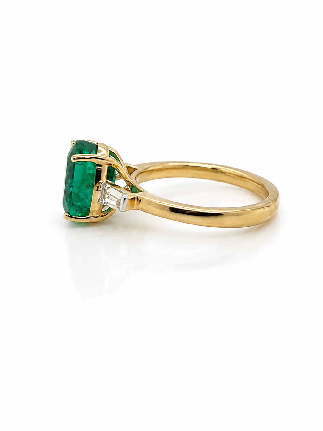 Diamond Trilogy Ring with 3.31cts Oval Cut Emerald in Yellow Gold