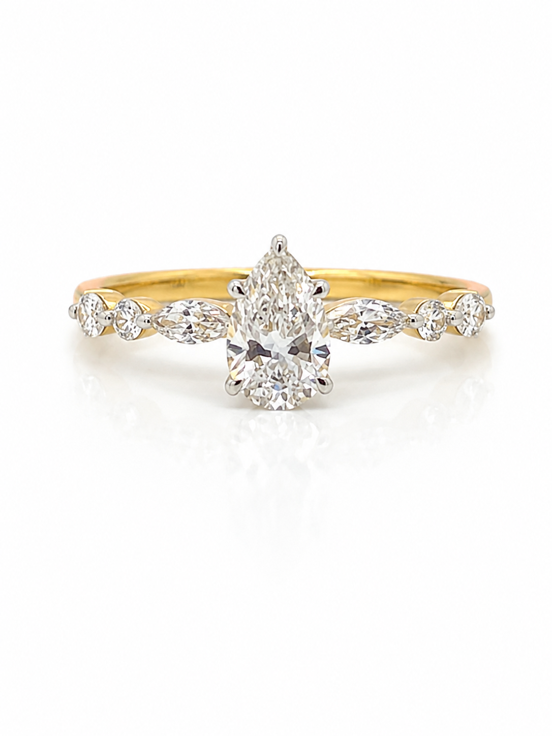 Diamond Pear Cut and Hidden Halo ring in Yellow Gold