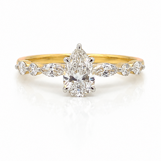 Pear Cut Diamond with Hidden Halo and a Marquise and Round Brilliant Cut Diamond Ring in Yellow Gold