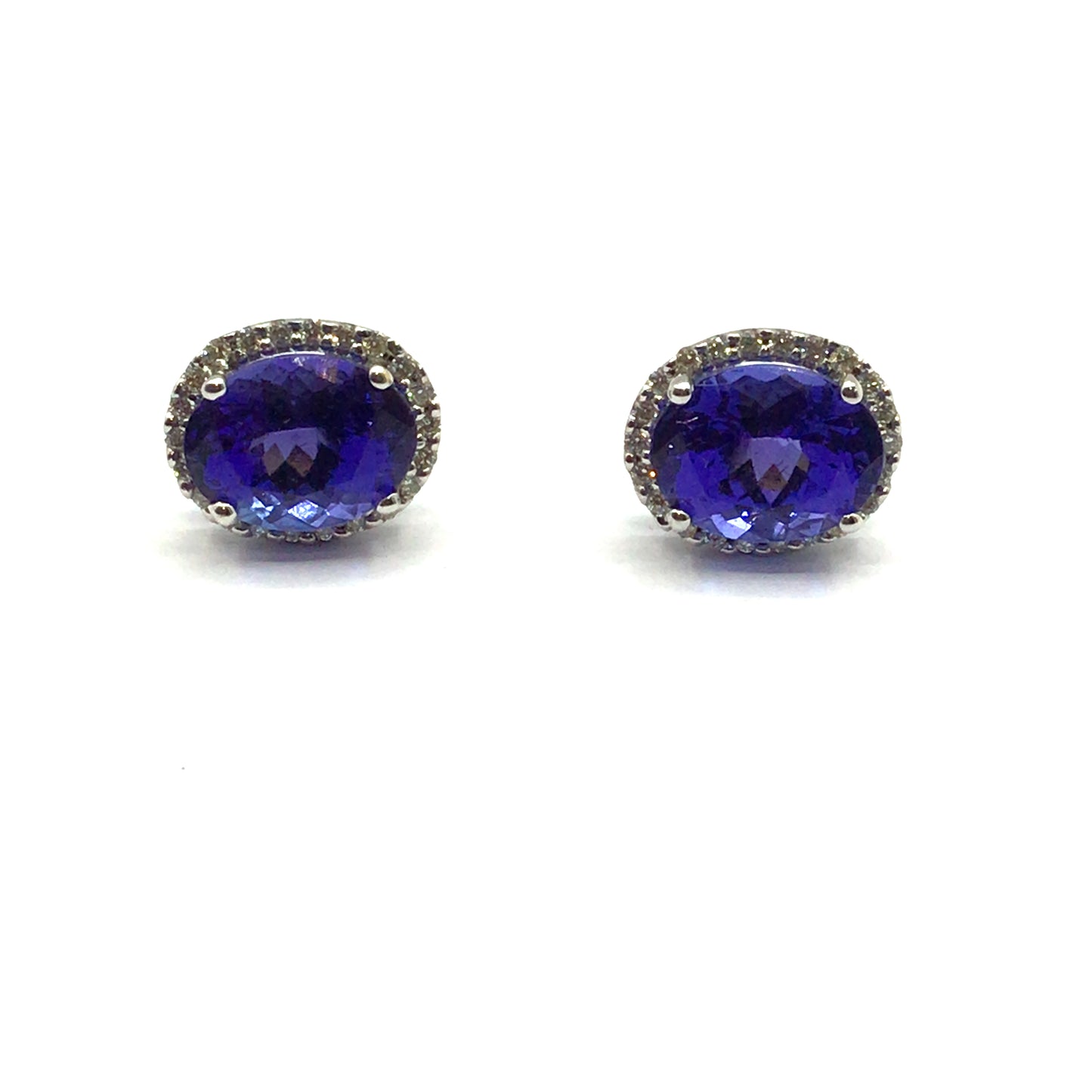 18ct white gold oval tanzanite 5.60ct with diamond halo