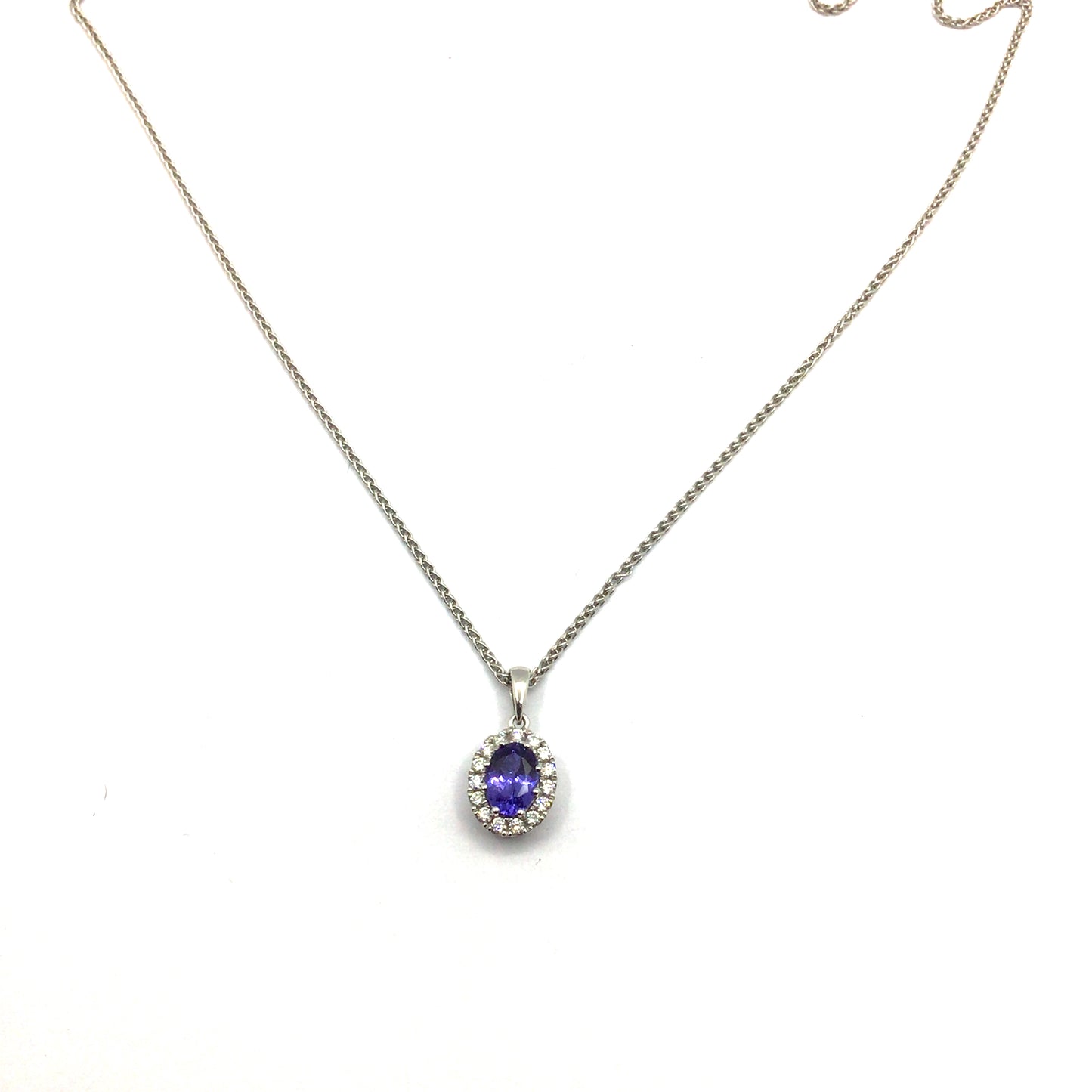 18ct white gold oval tanzanite with diamond halo