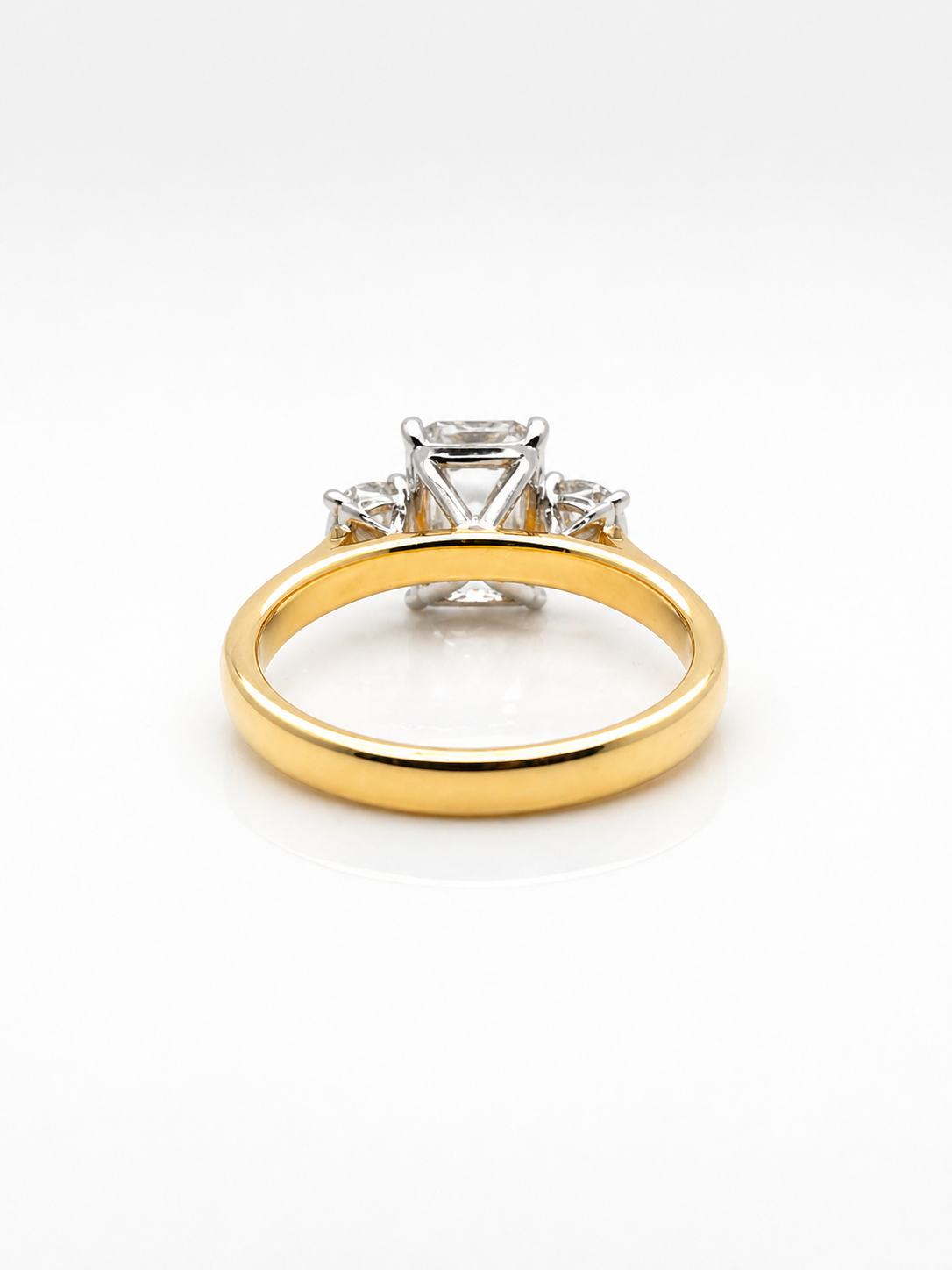 Emerald And Round White Diamond Triology Three Stone Engagement Ring
