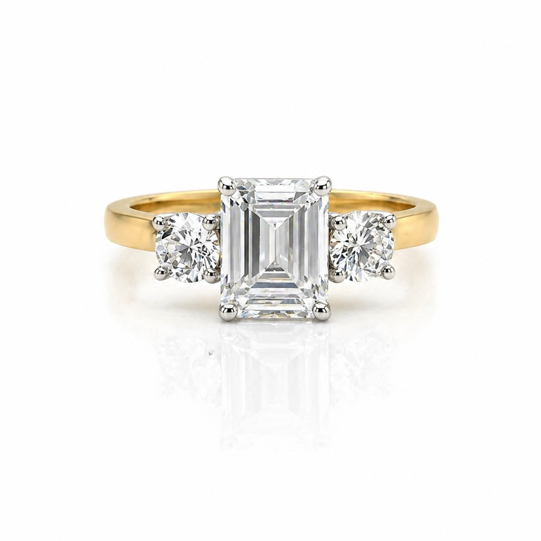 Emerald And Round White Diamond Triology Three Stone Engagement Ring