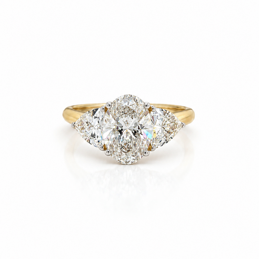 Oval and Trilliant Diamond Trilogy Ring in Yellow Gold