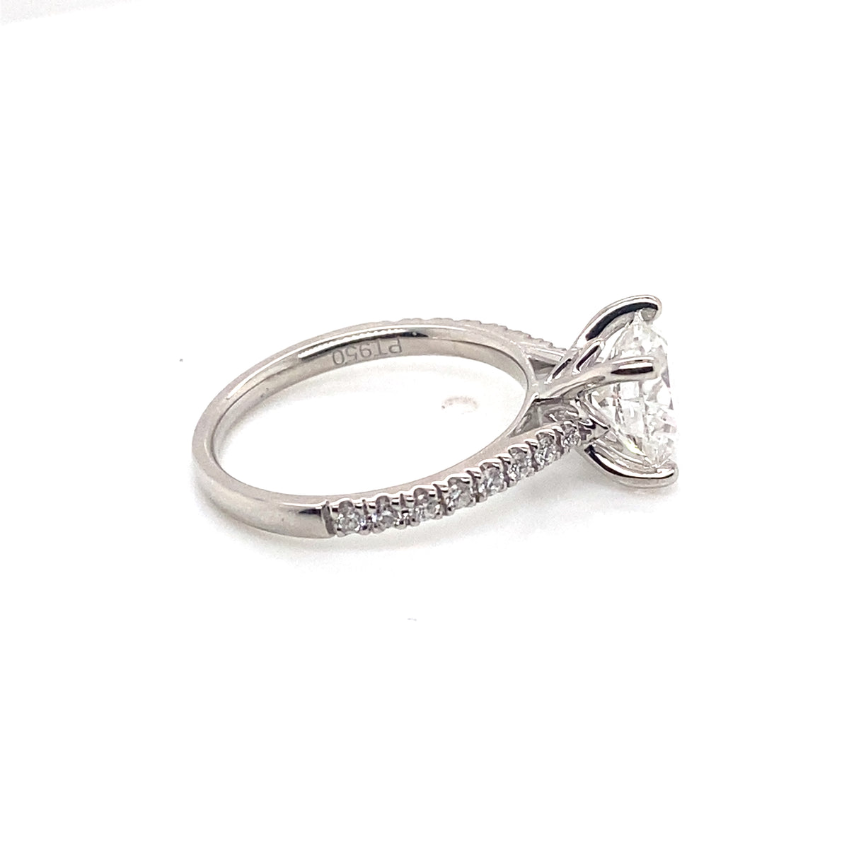 002046: platinum solitaire round cut diamond with pave set shoulders, tightened centre stone
