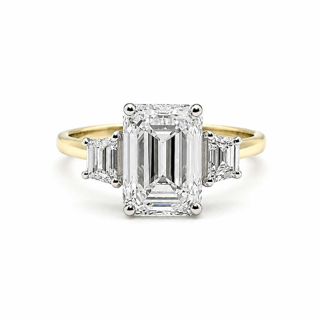 3ct Emerald Cut Diamond and Trapezoid Diamond Trilogy Ring in 18ct Yellow Gold with White Gold Head
