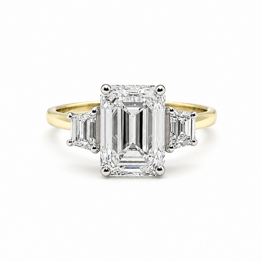 3ct Emerald Cut Diamond and Trapezoid Diamond Trilogy Ring in 18ct Yellow Gold with White Gold Head