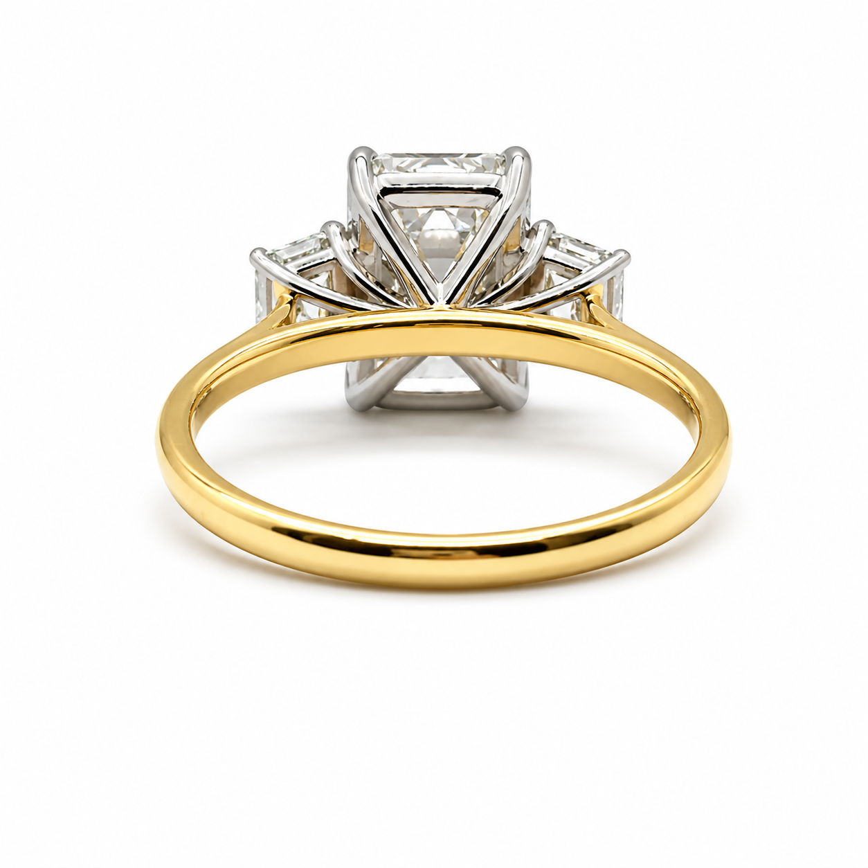 3ct Emerald Cut Diamond and Trapezoid Diamond Trilogy Ring in 18ct Yellow Gold with White Gold Head