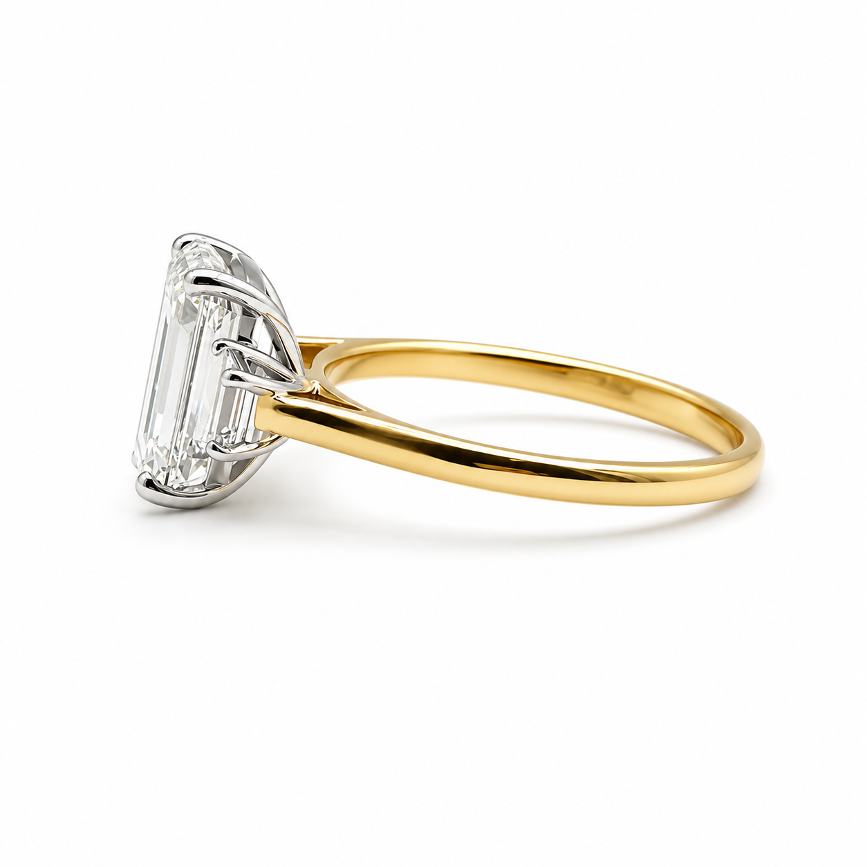 3ct Emerald Cut Diamond and Trapezoid Diamond Trilogy Ring in 18ct Yellow Gold with White Gold Head