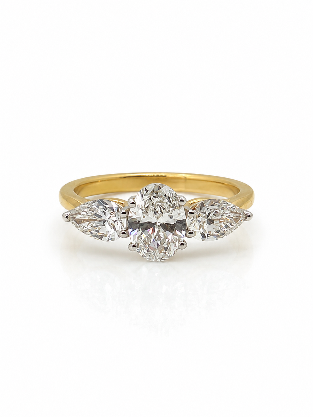 Oval and Pear Diamond Trilogy Ring in Yellow Gold