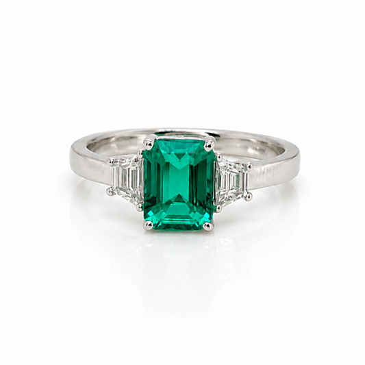 Emerald and Trapezoid Diamond Trilogy Ring in Platinum