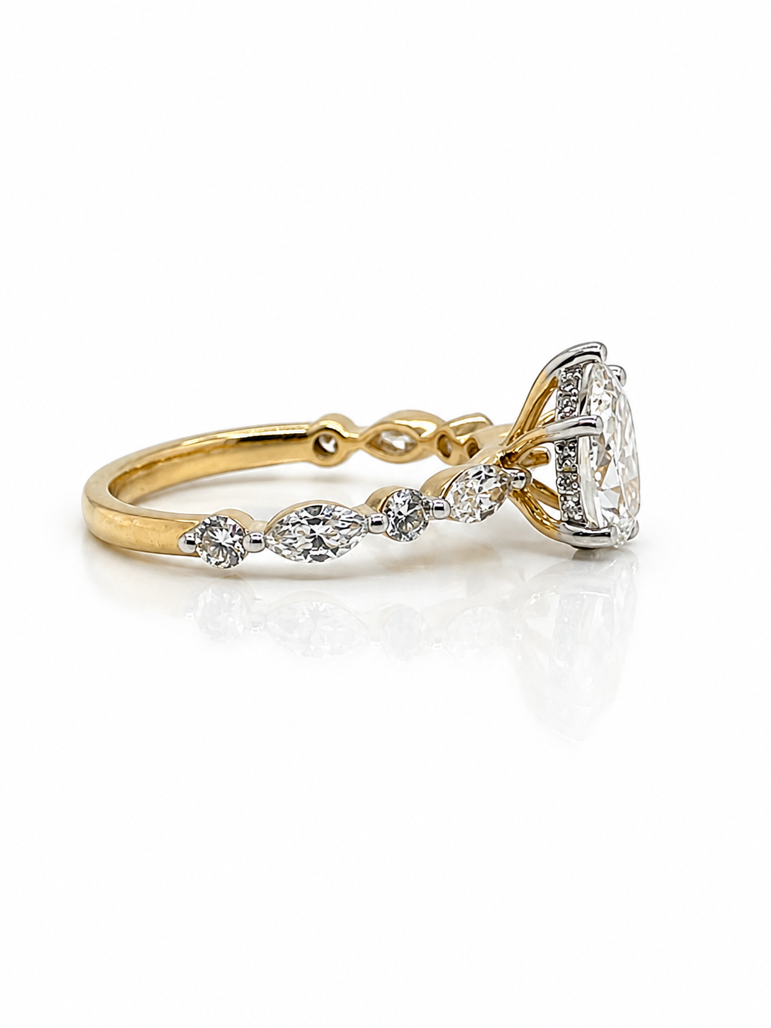 Diamond Pear Cut and Hidden Halo ring in Yellow Gold