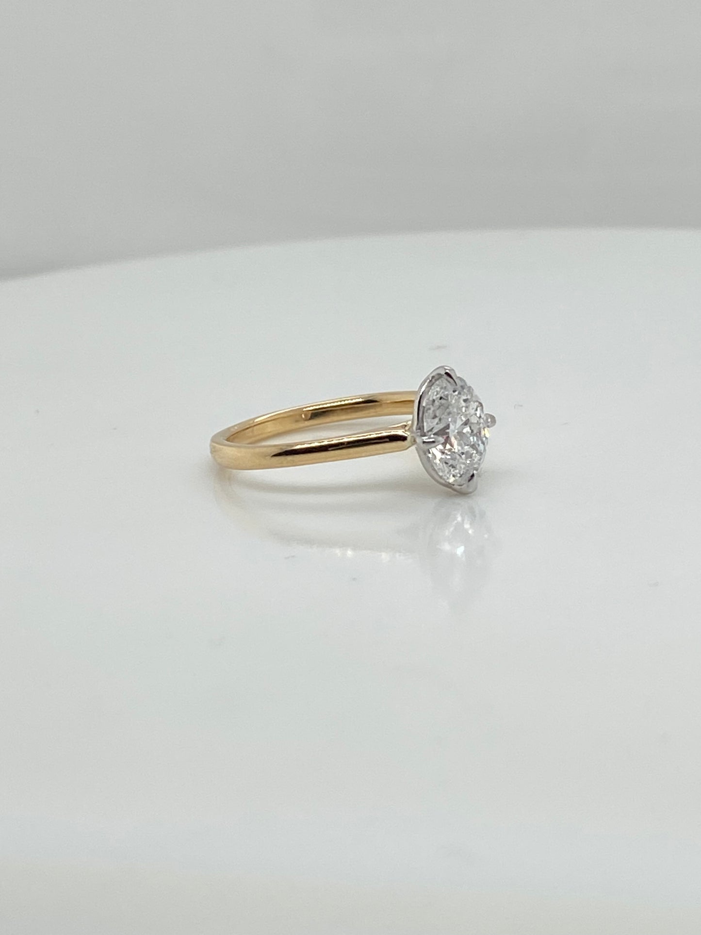 001660- 18ct yellow band with white head, finger size J, with dia halo, oval cut centre 7.5x5mm,, compass claws- add new white head with compass claw setting, but keep yellow band