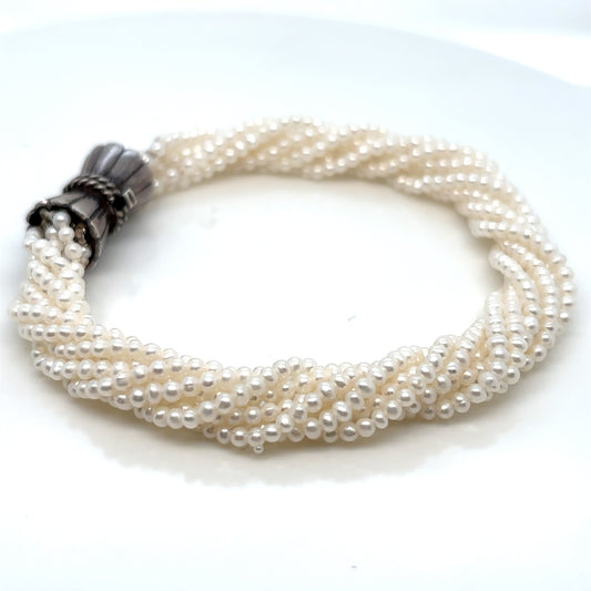 EIGHT ROW FRESHWATER CULTURED PEARL BRACELET - SILVER CLASP
