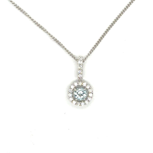 Round Brilliant Cut Sky Blue Topaz with a Cubic Zirconia Halo Set in Sterling Silver Pendant Necklace.